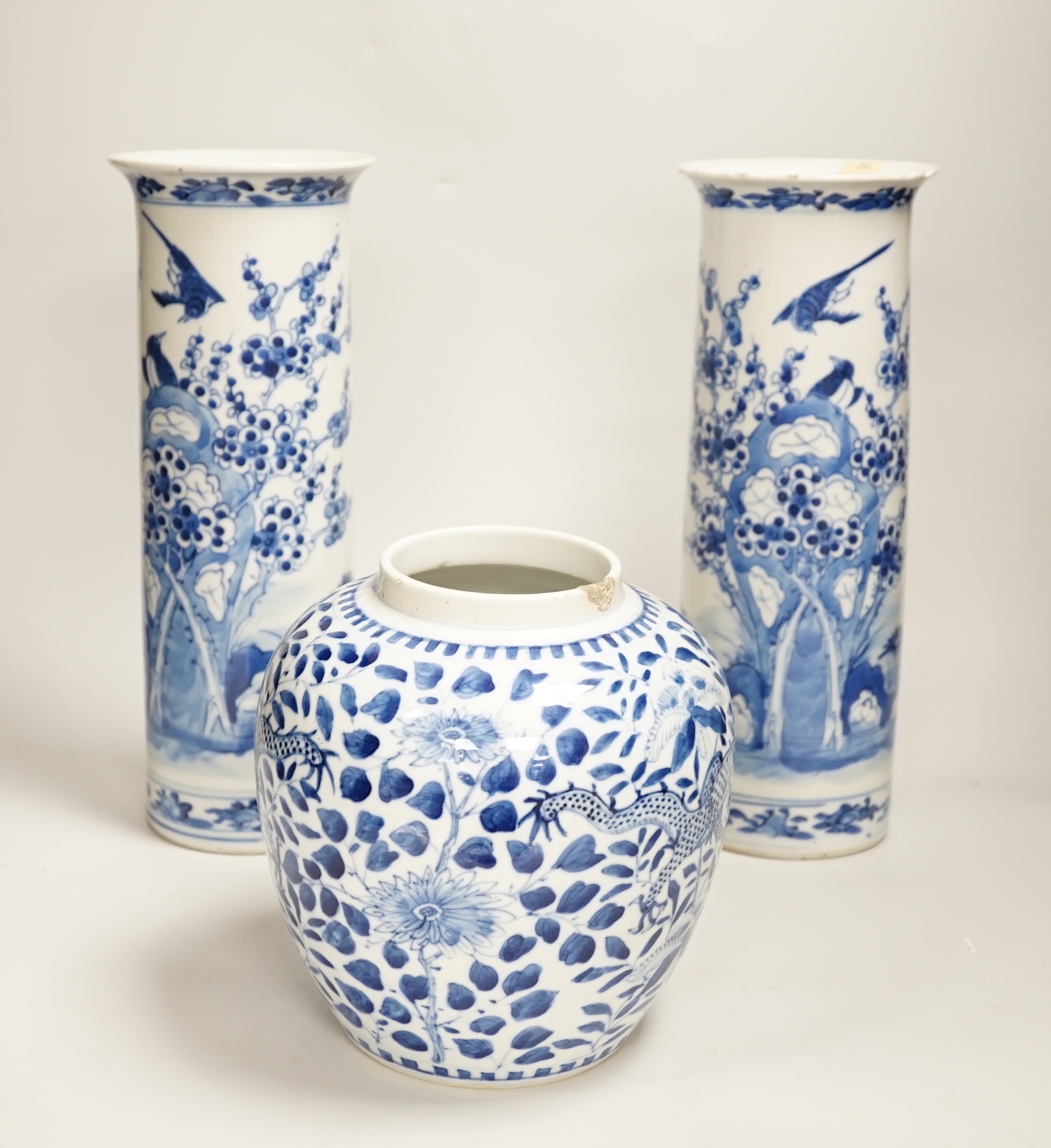 A pair of 19th century Chinese blue and white sleeve vases, and a similar ovoid ‘dragon’ jar, vases 31cm high